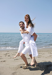 Image showing happy young couple have fun on beach