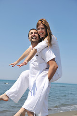 Image showing happy young couple have fun on beach