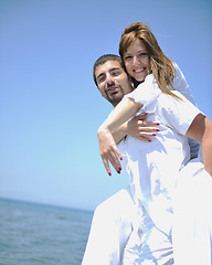 Image showing happy young couple have fun on beach