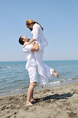 Image showing happy young couple have fun on beach