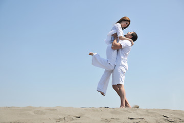 Image showing happy young couple have fun on beach