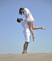 Image showing happy young couple have fun on beach