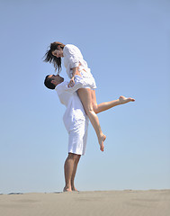 Image showing happy young couple have fun on beach