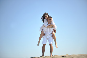 Image showing happy young couple have fun on beach