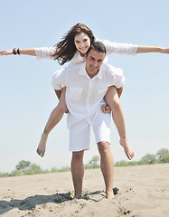 Image showing happy young couple have fun on beach