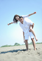 Image showing happy young couple have fun on beach