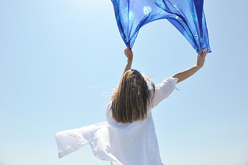 Image showing beautiful young woman on beach with scarf