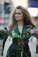 Image showing elegant woman on city street at night