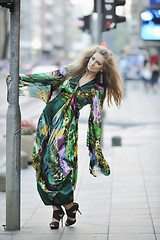 Image showing elegant woman on city street at night