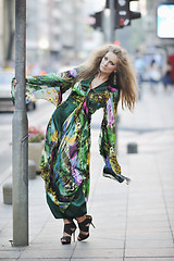 Image showing elegant woman on city street at night