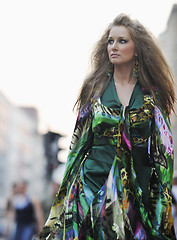 Image showing elegant woman on city street at night