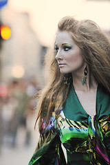 Image showing elegant woman on city street at night