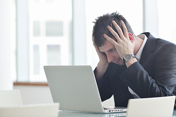 Image showing young business man alone in conference room