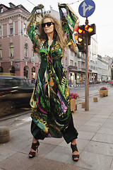 Image showing elegant woman on city street at night