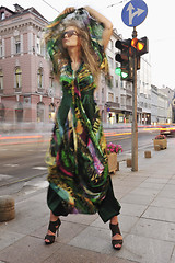 Image showing elegant woman on city street at night