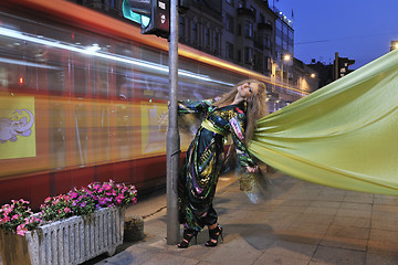 Image showing elegant woman on city street at night