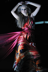 Image showing elegant woman on city street at night