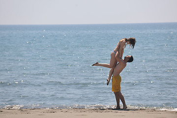 Image showing happy young couple have fun on beach