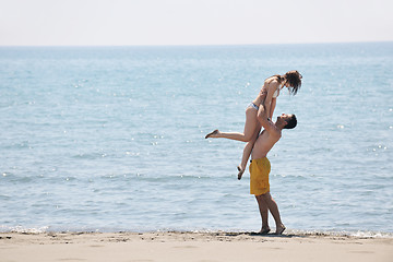 Image showing happy young couple have fun on beach