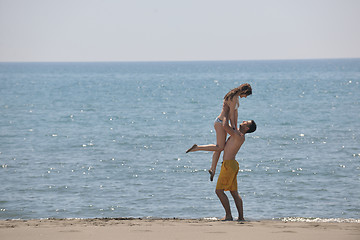 Image showing happy young couple have fun on beach