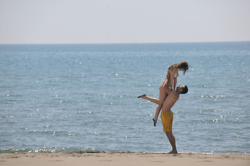 Image showing happy young couple have fun on beach