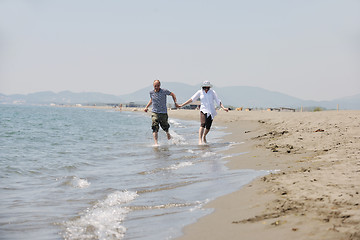 Image showing happy young couple have fun on beach