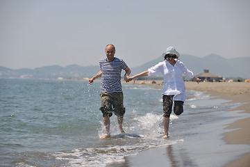 Image showing happy young couple have fun on beach