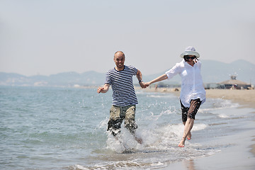 Image showing happy young couple have fun on beach