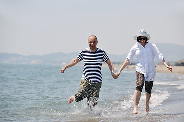 Image showing happy young couple have fun on beach