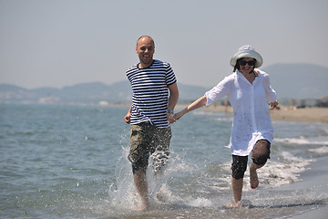 Image showing happy young couple have fun on beach