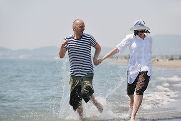 Image showing happy young couple have fun on beach