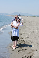 Image showing happy young couple have fun on beach