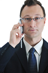 Image showing businessman with cellphone isolated on white