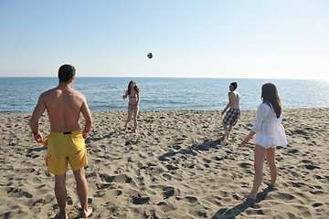 Image showing young people group have fun and play beach volleyball