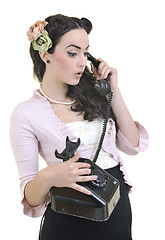 Image showing pretty girl talking on old phone