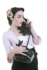 Image showing pretty girl talking on old phone