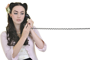 Image showing pretty girl talking on old phone