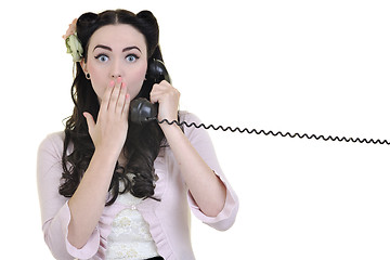 Image showing pretty girl talking on old phone