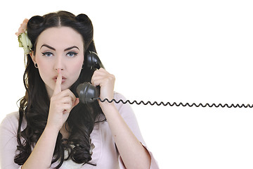 Image showing pretty girl talking on old phone