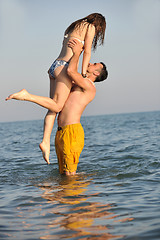 Image showing happy young couple have fun on beach