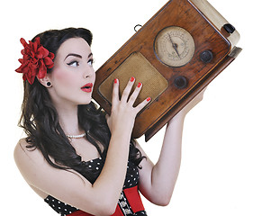 Image showing pretty girl listening music on  radio 