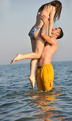 Image showing happy young couple have fun on beach