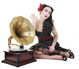 Image showing pretty girl listening music on old gramophone