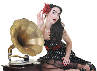 Image showing pretty girl listening music on old gramophone