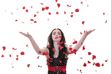 Image showing woman with falling rose petals