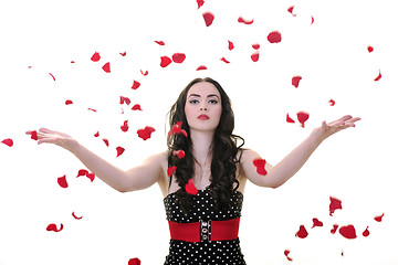 Image showing woman with falling rose petals