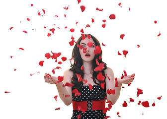 Image showing woman with falling rose petals