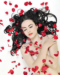 Image showing beautiful young nude woman with roses isolated on white