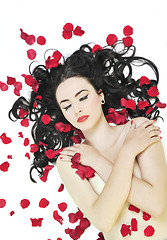 Image showing beautiful young nude woman with roses isolated on white