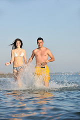 Image showing happy young couple have fun on beach